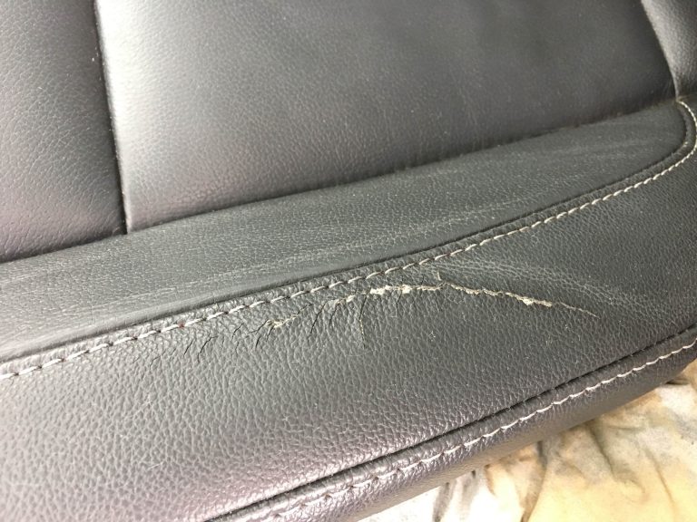 damaged gray car upholstery