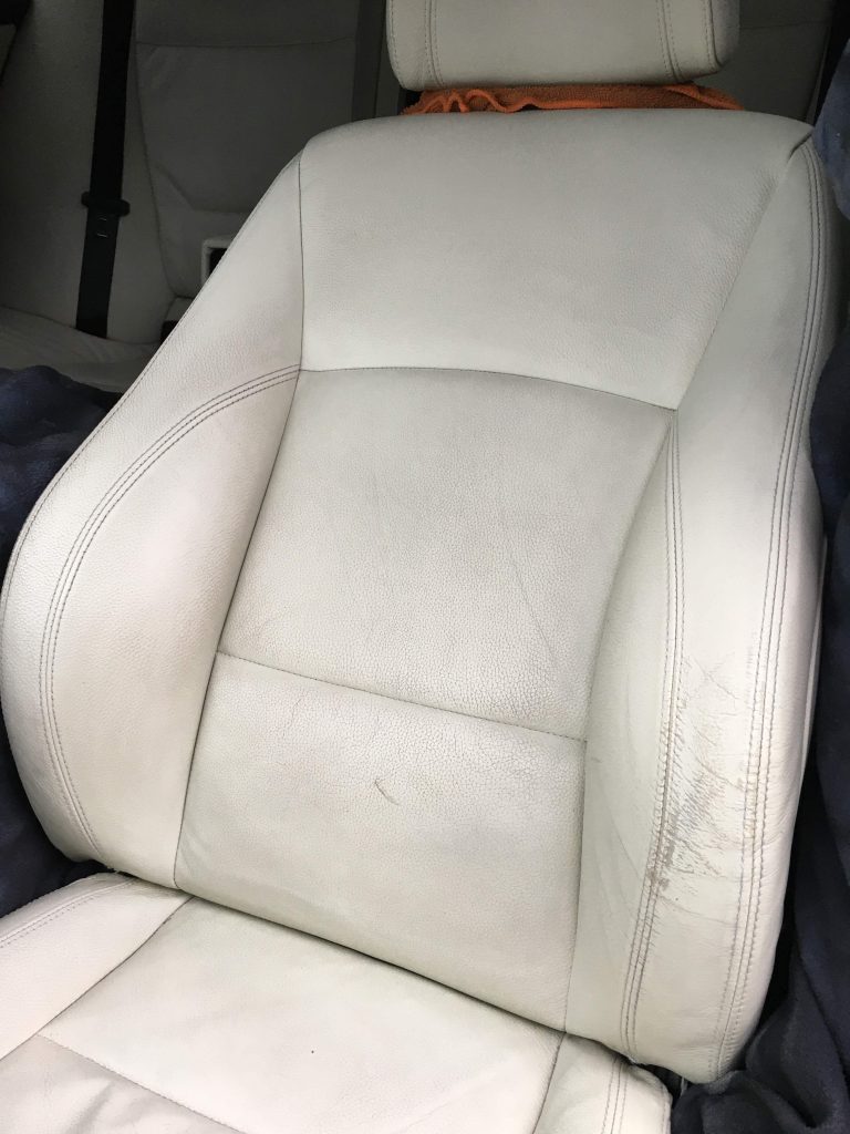Front seat of a car with dirty upholstery